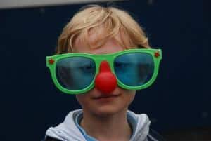 Child in clown glasses and nose